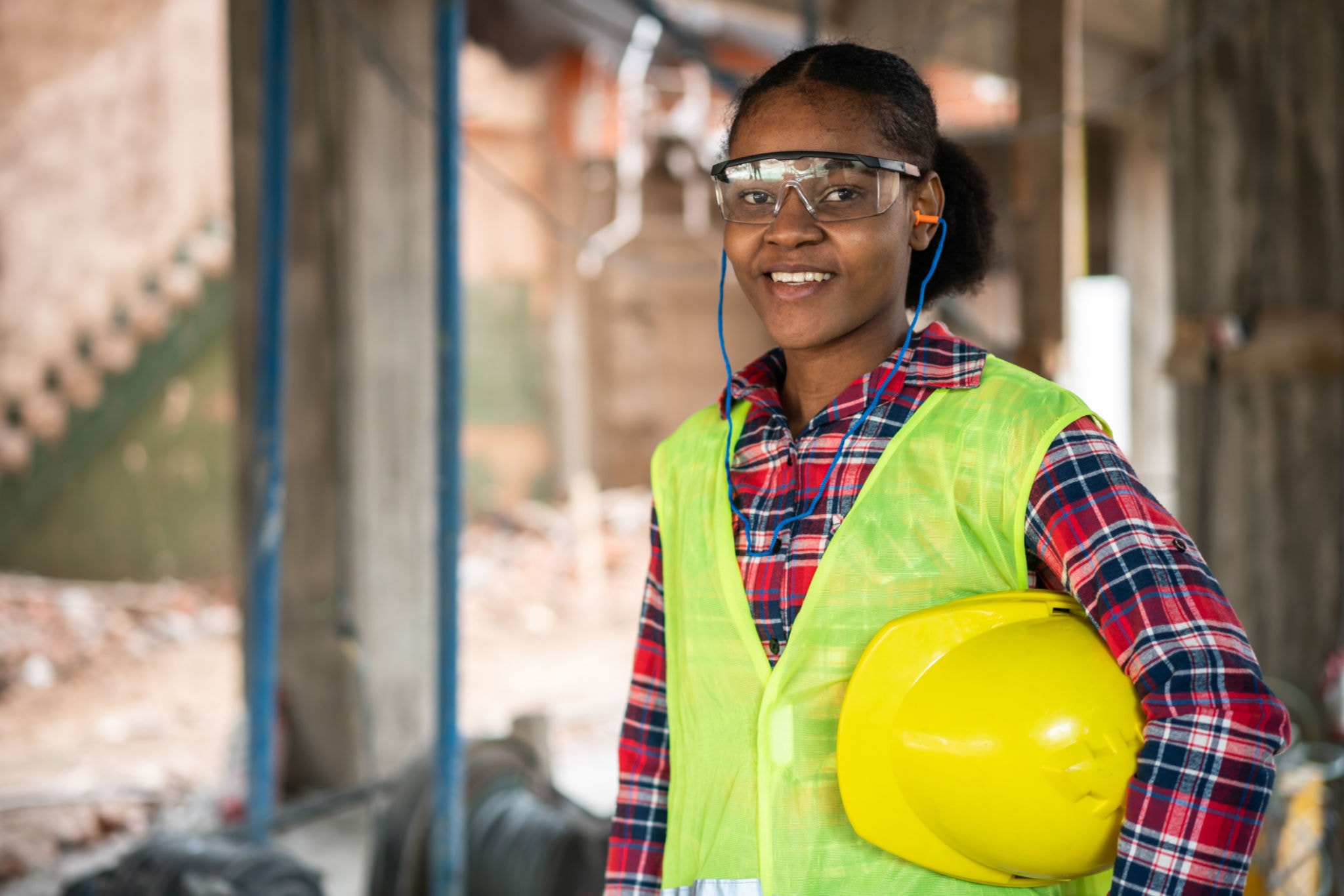 ManoWorks engineer in safety vest and hard hat on site