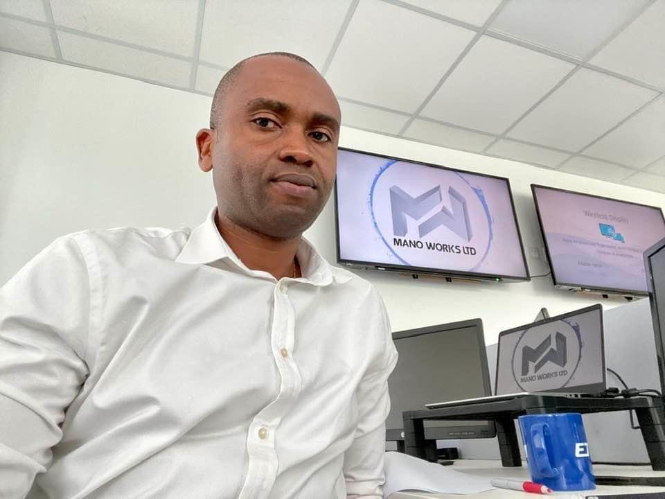 ManoWorks staff member working at desk in office